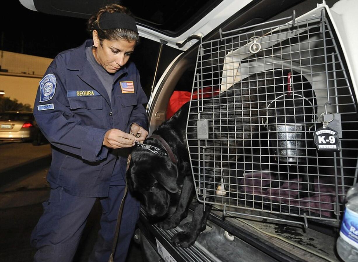 Los Angeles County Fire Department's Jasmine Segura and her rescue dog Cadillac prepare to depart for Haiti on Jan.