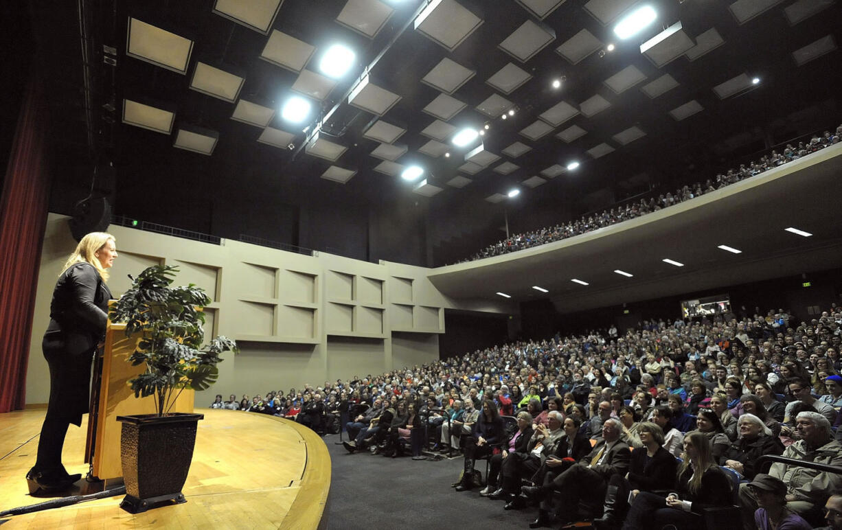 Cheryl Strayed, left, author of the best-selling hiking memoir &quot;Wild,&quot; gives a presentation to a packed house Thursday at LaSells Stewart Center on the Oregon State University campus in Corvallis, Ore. Nearly 2,000 people filled the auditorium hours after a movie based on her best-selling memoir earned two Oscar nominations.