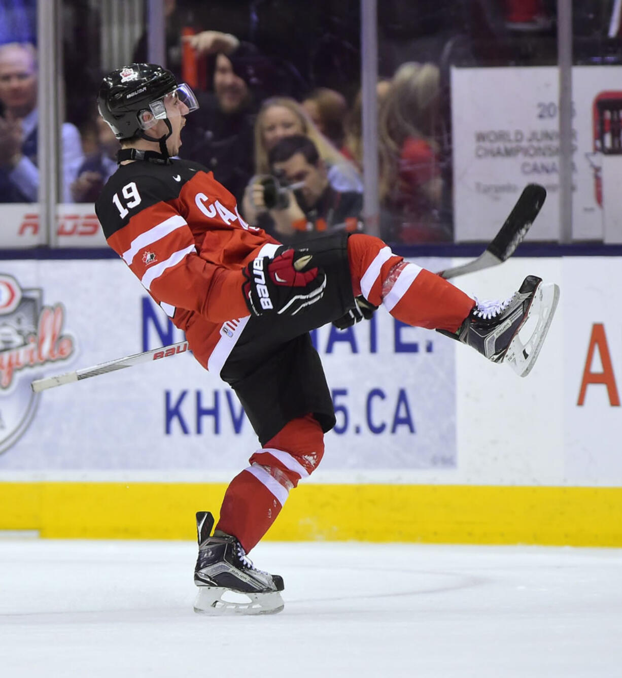 Canada's Nic Petan (19) celebrates after scoring his third goal against the Slovakia during third-period semifinal hockey action at the world junior championship in Toronto, Sunday, Jan. 4, 2015.