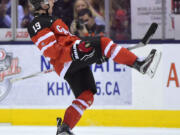 Canada's Nic Petan (19) celebrates after scoring his third goal against the Slovakia during third-period semifinal hockey action at the world junior championship in Toronto, Sunday, Jan. 4, 2015.