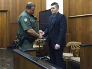 Jarrod Wiebe is placed in handcuffs in Clark County Superior Court after a jury found him guilty Oct. 1 of multiple felonies associated with a home-invasion robbery in Ridgefield.