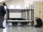 Actress Angie Westerberg runs through a scenario for Lincoln County Sheriff's Deputy Tom Sherbon during a comprehensive mental health training exercise at the Clark County Jail Work Center on Thursday.