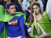 Seattle Seahawks fans react during the second half of the Super Bowl in Glendale, Ariz.