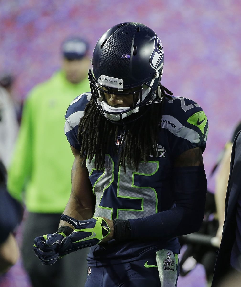 Seattle cornerback Richard Sherman walks off the field after the Seahawks lost Super Bowl XLIX to the New England Patriots on Sunday in Glendale, Ariz.