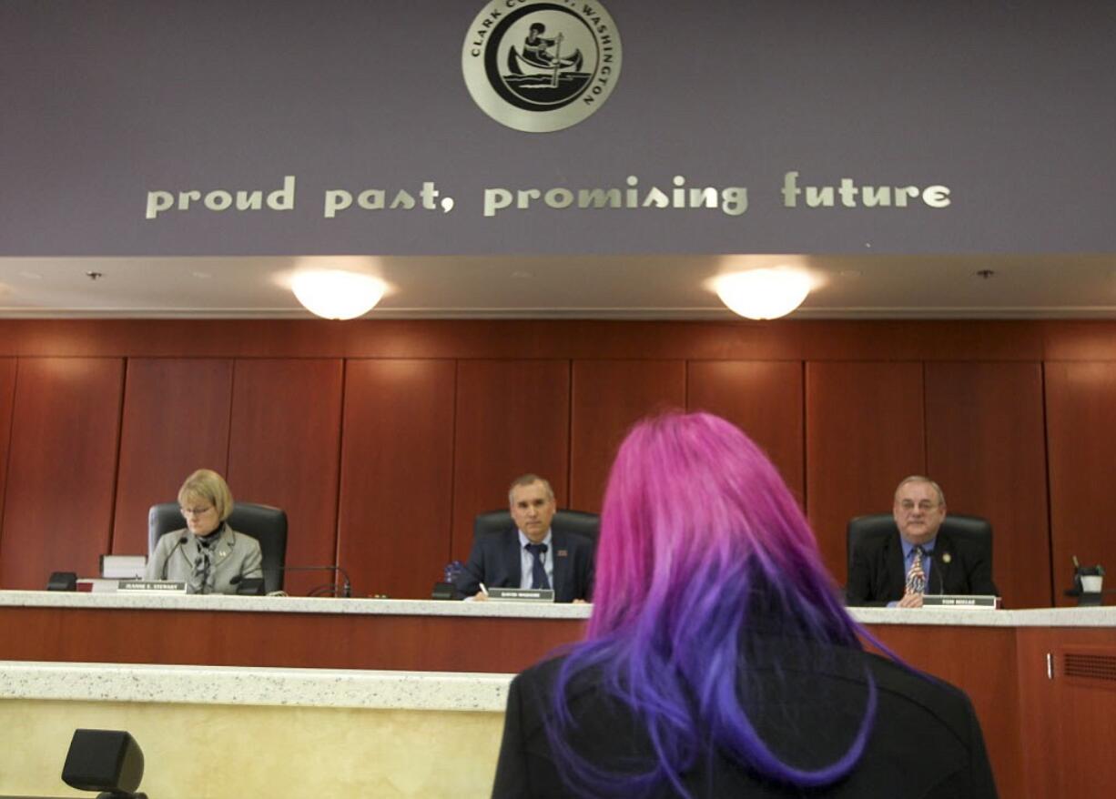 Kimberly Abell of Camas speaks to the Clark County Council on Tuesday in Vancouver about a motion to display &quot;In God We Trust&quot; in the public hearing room.