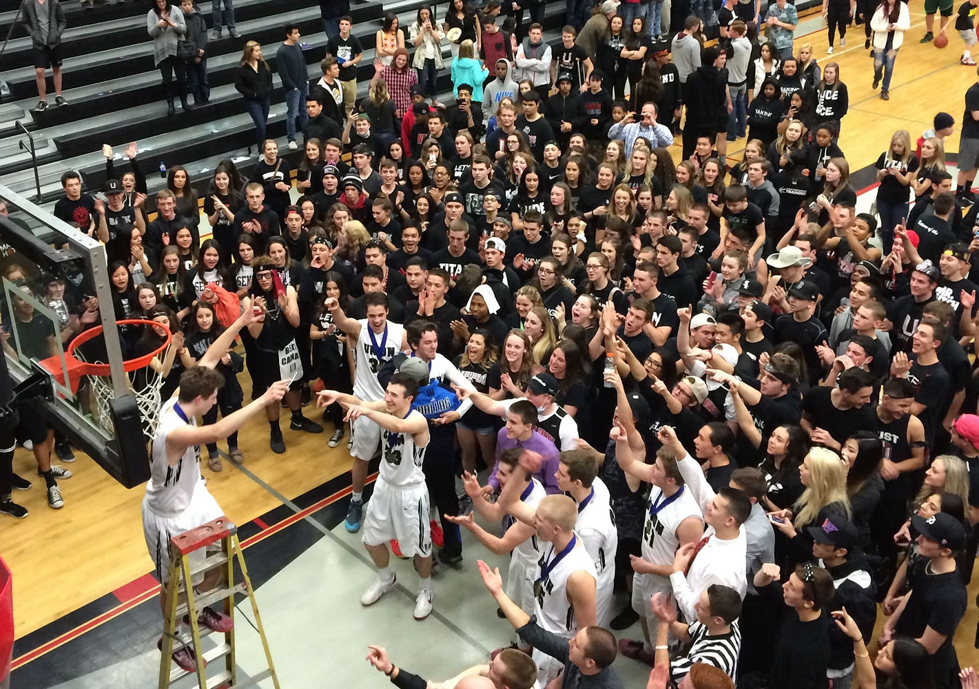 Union players cut down the net as fans join in the celebration on Thursday, Feb. 19, 2015.