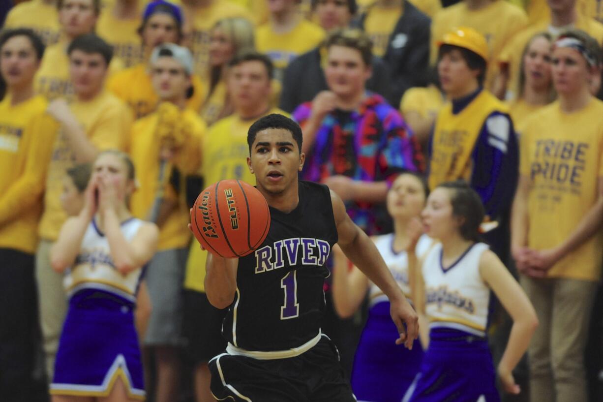 Columbia River's Nathan Hawthorne (1) brings the ball down court against Auburn in the bi-district round of Boys 3A basketball playoffs in Vancouver, WA., Thursday, Feb. 12, 2015.