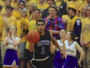 Columbia River's Nathan Hawthorne (1) brings the ball down court against Auburn in the bi-district round of Boys 3A basketball playoffs in Vancouver, WA., Thursday, Feb. 12, 2015.