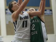 Skyview's Genevieve Lo, 11, drives to the basket against Emerald Ridge in the 4A girls bi-district playoff game at Skyview High School, Thursday, February 13, 2014.