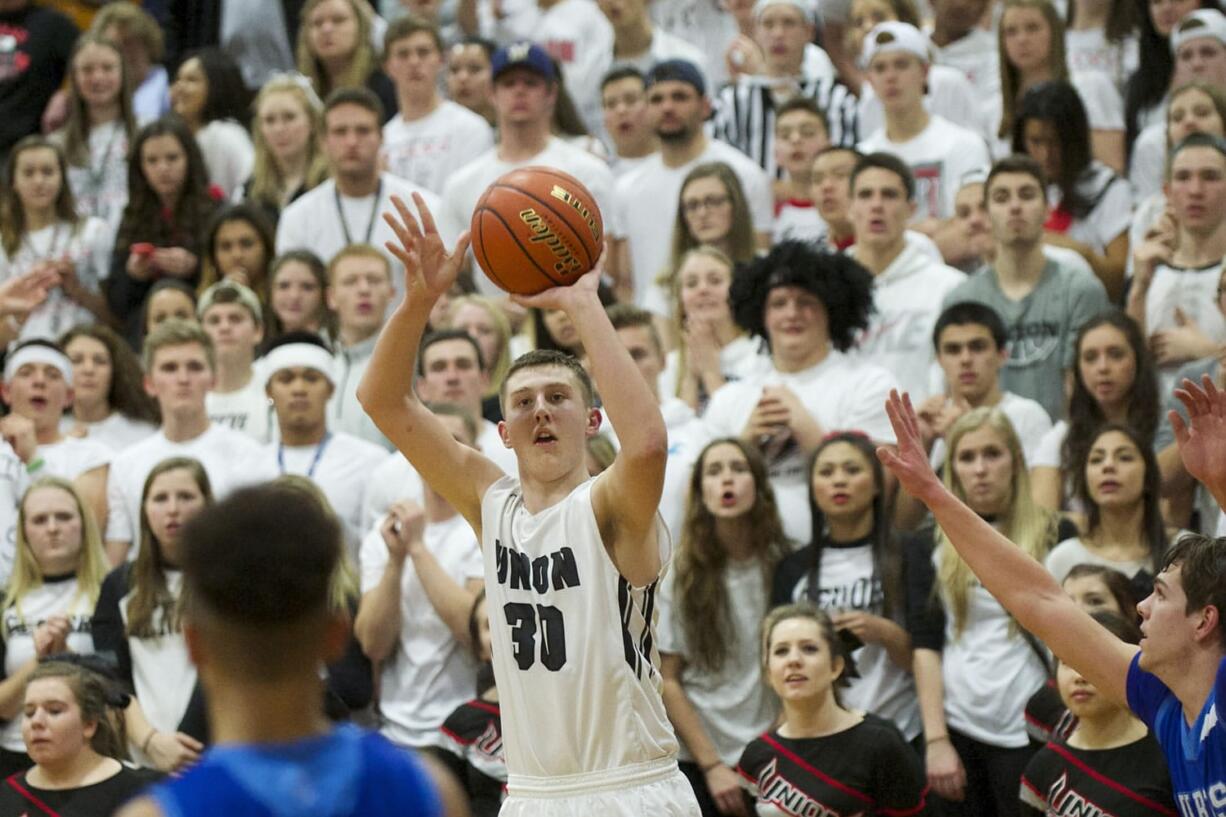 Cameron Cranston shoots as Union comes back in the fourth quarter to beat Curtis at the Class 4A regional round of state on Friday, Feb.