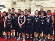 The King's Way Christian boys basketball team poses on the court after beating Seattle Academy 54-51 in overtime in the Class 1A state playoffs on Saturday.