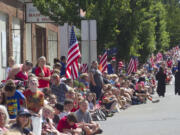 Scores of visitors line the streets to watch the Independence Day parade in Ridgefield on July 4.