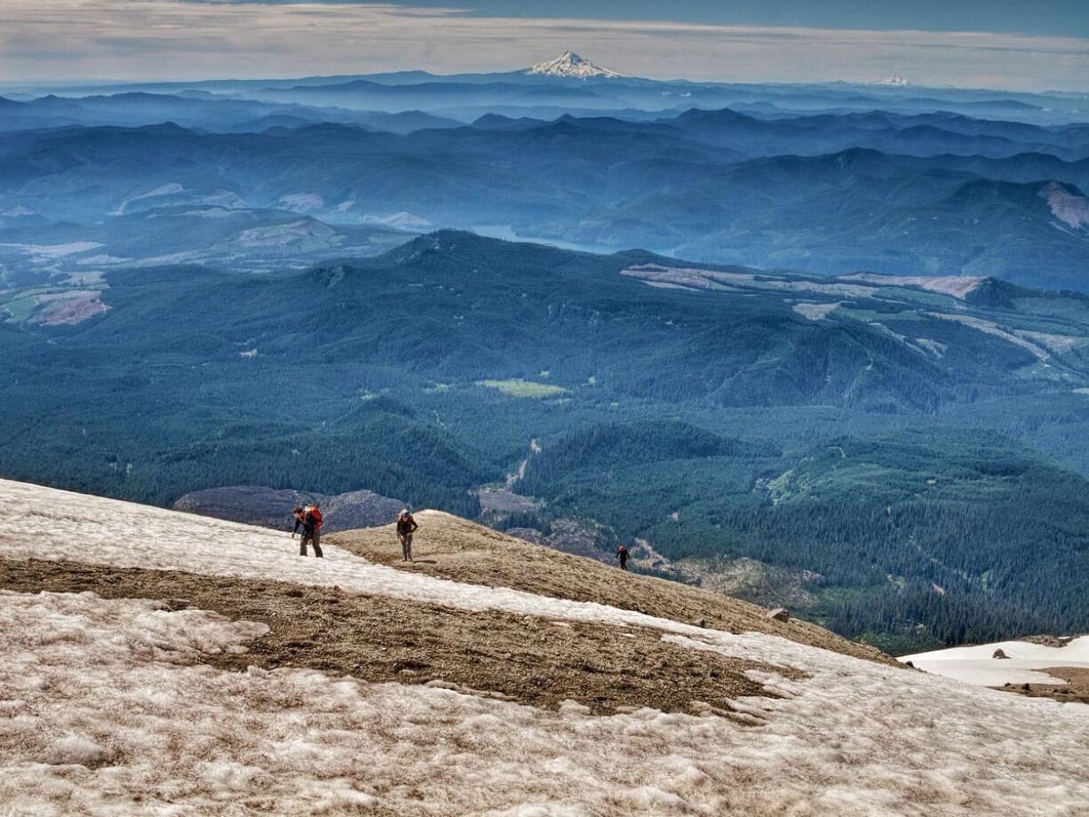 Climbers head up the last hundred feet of Mount St. Helens in Washington. Covered in ash from a 1980 eruption, the upper portion of the mountain is the hardest, when feet will slide downhill with every step. Illustrates MOUNT-STHELENS (category t), by Anne Farrar (C) 2015, The Washington Post. Moved Tuesday, March 3, 2015.