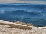 Climbers head up the last hundred feet of Mount St. Helens in Washington. Covered in ash from a 1980 eruption, the upper portion of the mountain is the hardest, when feet will slide downhill with every step. Illustrates MOUNT-STHELENS (category t), by Anne Farrar (C) 2015, The Washington Post. Moved Tuesday, March 3, 2015.