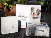 Three pet tech devices, from left: the Narrative Clip, a wearable camera; Voyce, a device that tracks a pet's activity level; and Tagg, a pet-tracking device.