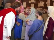 Mark Dahl, who plays Jesus in &quot;Bow the Knee,&quot; visits with some of the children in the musical during a dress rehearsal Sunday at Liberty Bible Church of the Nazarene in Salmon Creek.