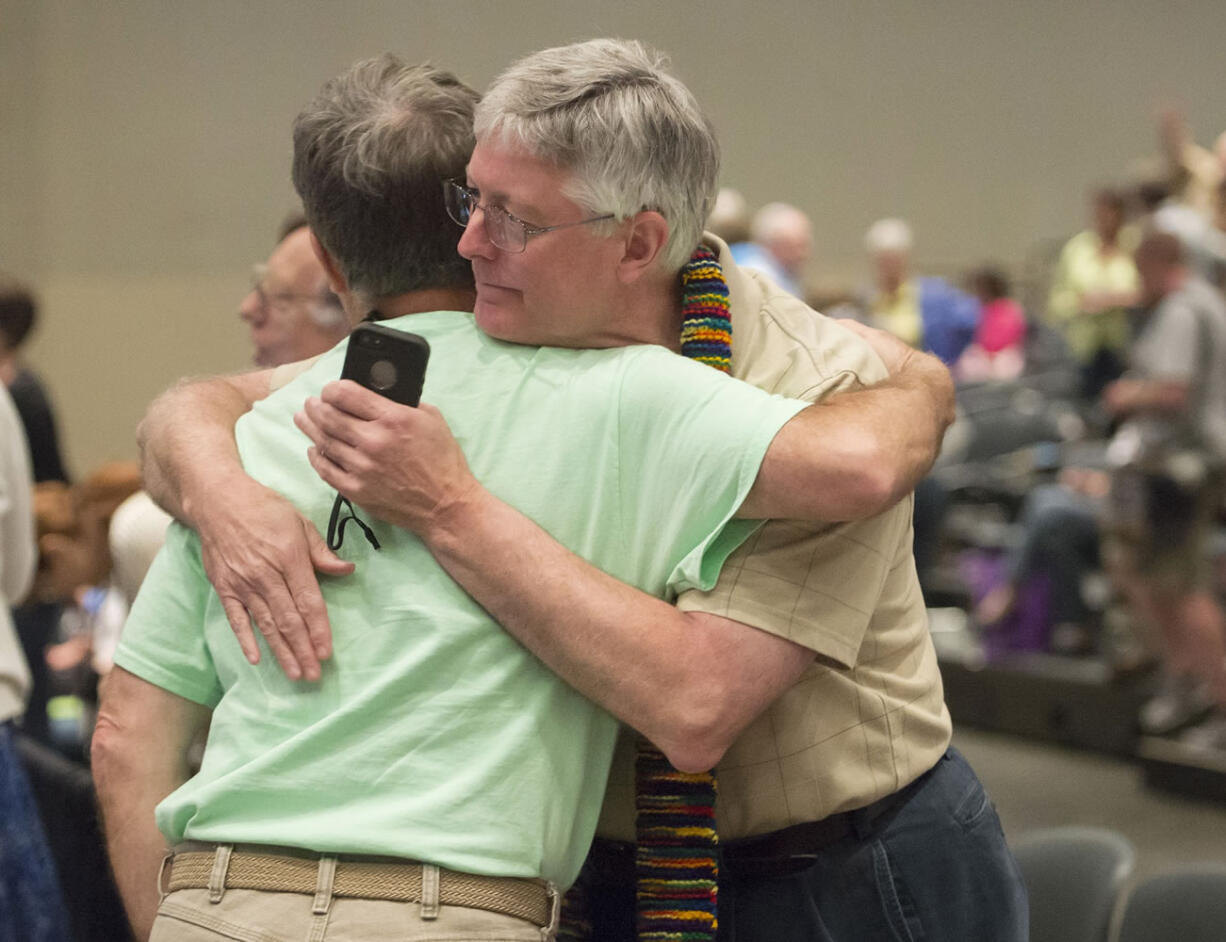 Gary Lyon, left, of Leechburg, Pa., and Bill Samford of Hawley, Pa., celebrate in June after a vote allowing Presbyterian pastors discretion in marrying same-sex couples at the 221st General Assembly of the Presbyterian Church at Cobo Hall in Detroit.