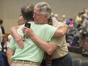 Gary Lyon, left, of Leechburg, Pa., and Bill Samford of Hawley, Pa., celebrate in June after a vote allowing Presbyterian pastors discretion in marrying same-sex couples at the 221st General Assembly of the Presbyterian Church at Cobo Hall in Detroit.