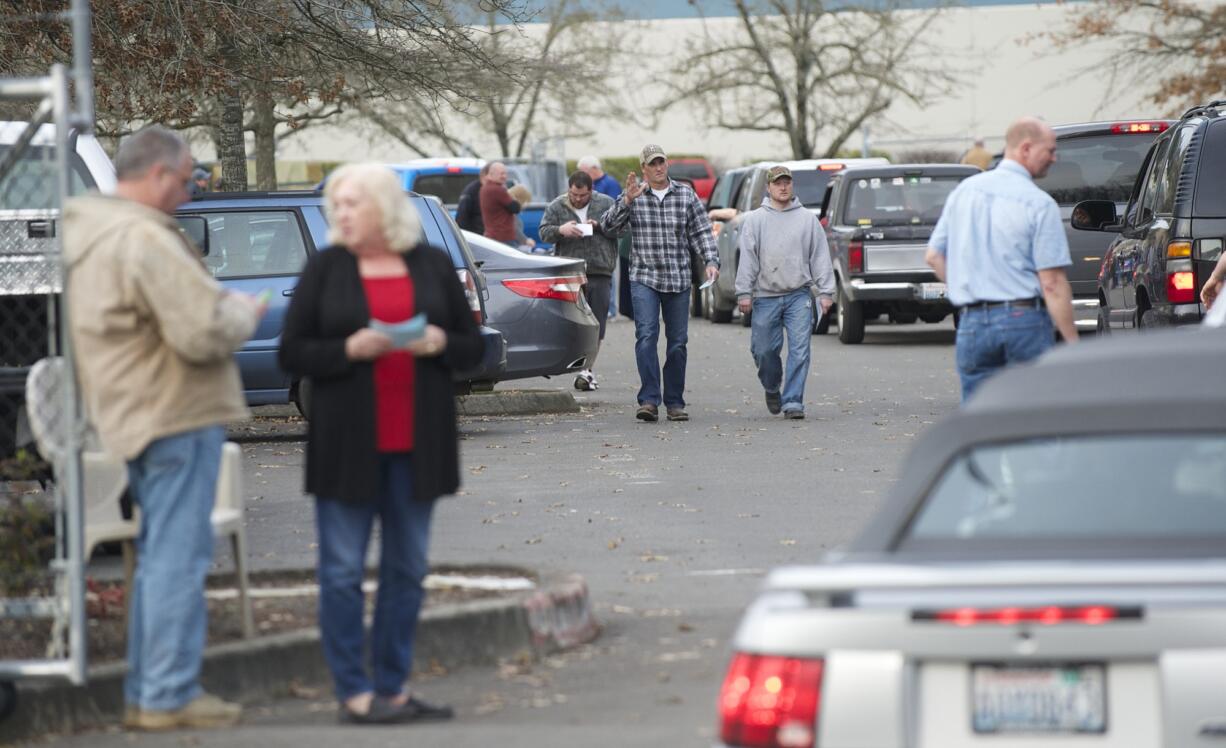 Christensen Shipyards hands out paychecks to employees, Friday, February 13, 2015.