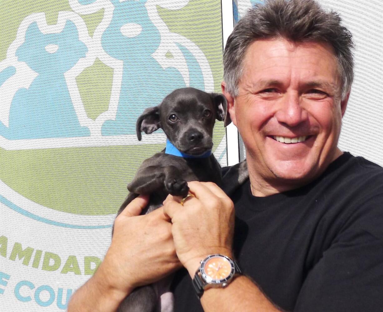 Finding Rover founder John Polimeno holds Ringo, who was the subject in a demonstration of his pet-finding app.