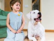 Fotolia
Capitalizing on kids' natural empathy with animals can help them overcome their fear of your pet.