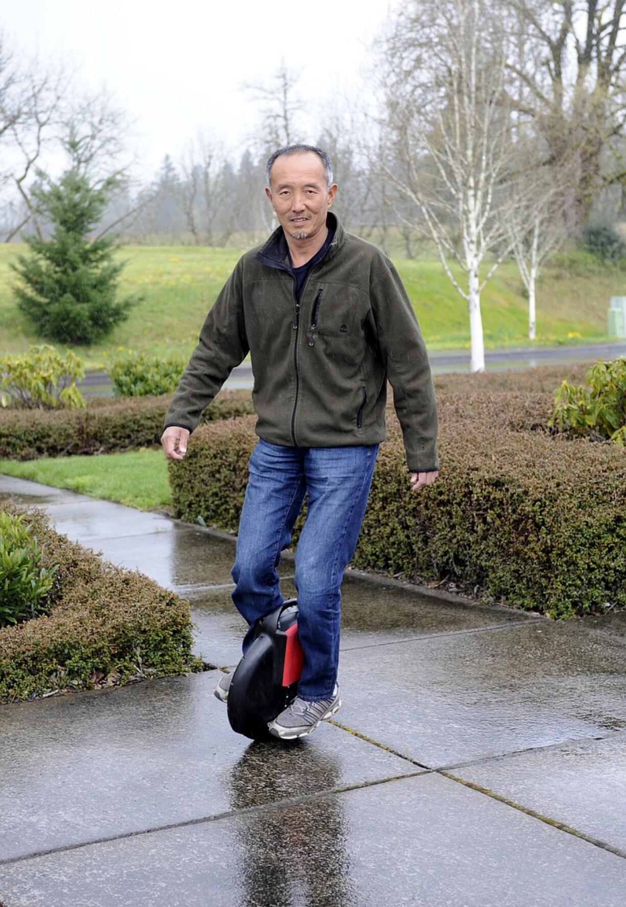 Inventor Shane Chen rides the Solowheel outside his office in Camas.