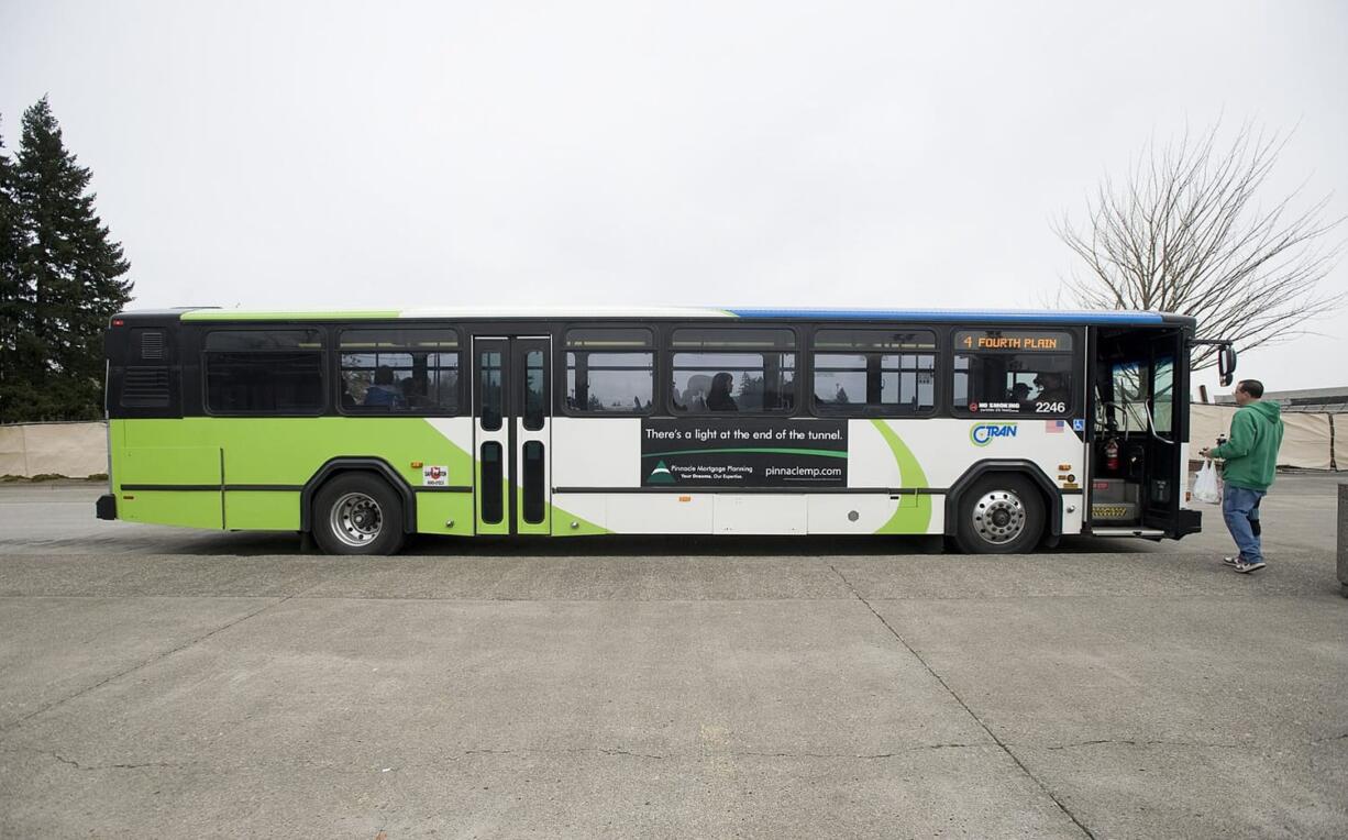 A C-Tran bus waits for passengers at the Vancouver Mall Transit Center. The C-Tran Board of Directors will consider another in a series of fare increases during its monthly meeting on Tuesday. Board members will also hear testimony during a public hearing on the subject. If approved, the changes would take effect Sept.