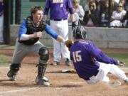 Kelso catcher Zak Schueller tags out Columbia River runner Tyler Hellman at home on Monday, May 4.