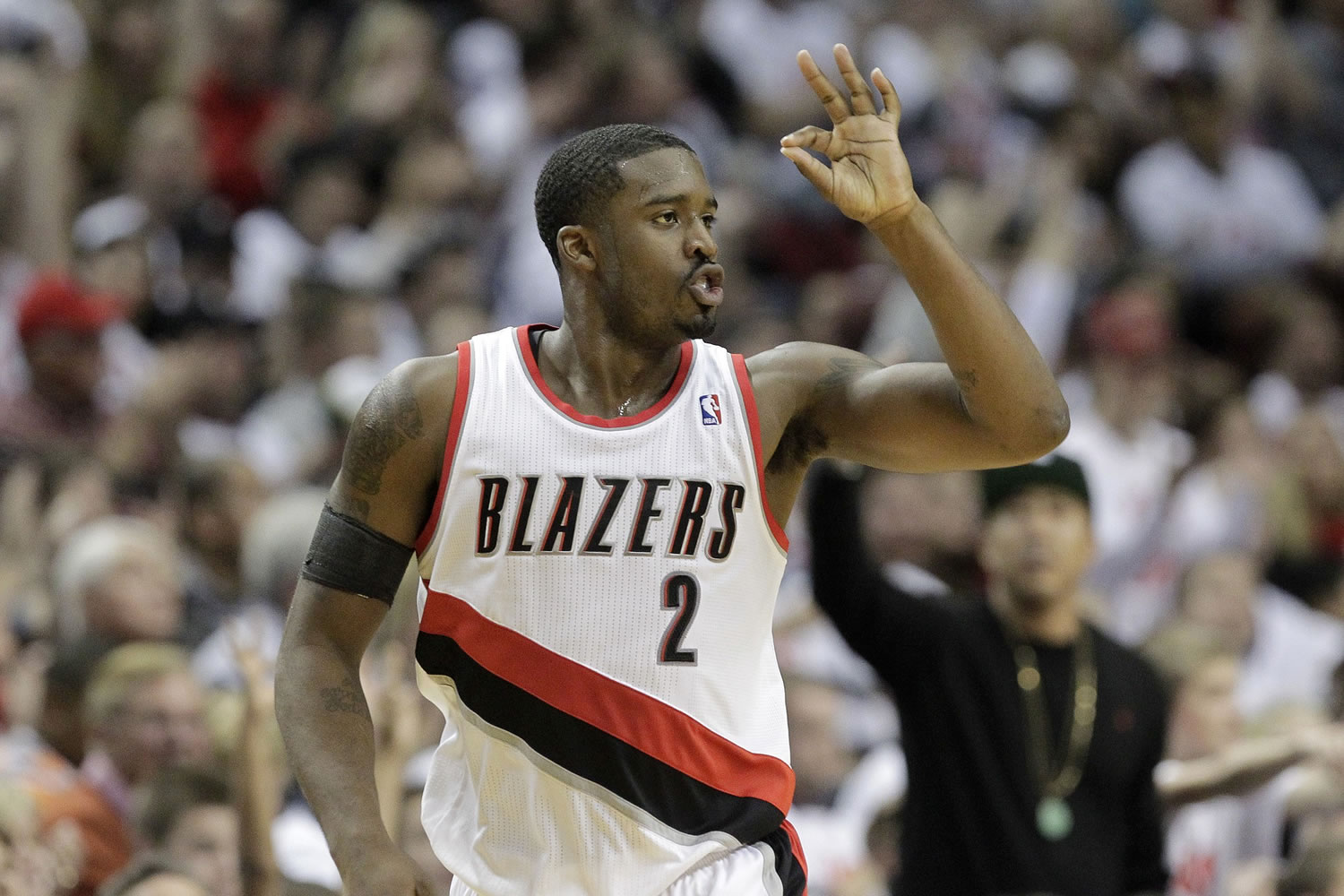 Portland Trail Blazers guard Wesley Matthews holds up three fingers after sinking a three point basket during an NBA basketball game Nov.