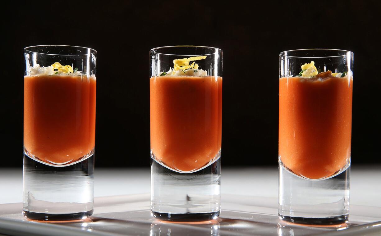 Gazpacho becomes a shooter, topped with buttery fresh crab and chives.