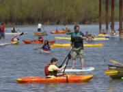 People test out kayaks and stand-up paddle boards during April's Paddlefest at Vancouver Lake Regional Park.