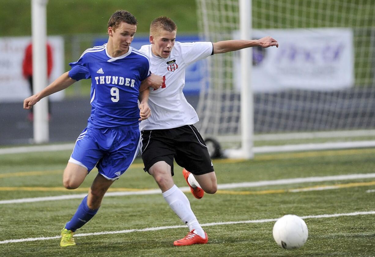 Mountain View player Abdul el-Hoot vies with Camas's Bennett Lehner during a 4A district boys soccer playoff match in Camas on Tuesday.