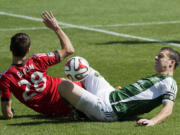 Portland Timbers midfielder Will Johnson, right, has not played since suffering a broken leg on this play in a match last September in Toronto.