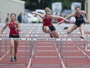 Camas High School's Jordan Davis clears a hurdle in the women's 100m Hurdles as she competes at the 4A GSHL District track meet at McKenzie Stadium in Vancouver Tuesday May 19, 2015.