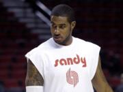 Portland Trail Blazers forward LaMarcus Aldridge wears a warmup shirt in memory of season ticket holder Sandra Zickefoose before a game on Sunday, Nov.