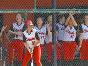 Camas players cheer on their teammates against Battle Ground in the 4A District Softball Championship in Battle Ground on May 20, 2015.