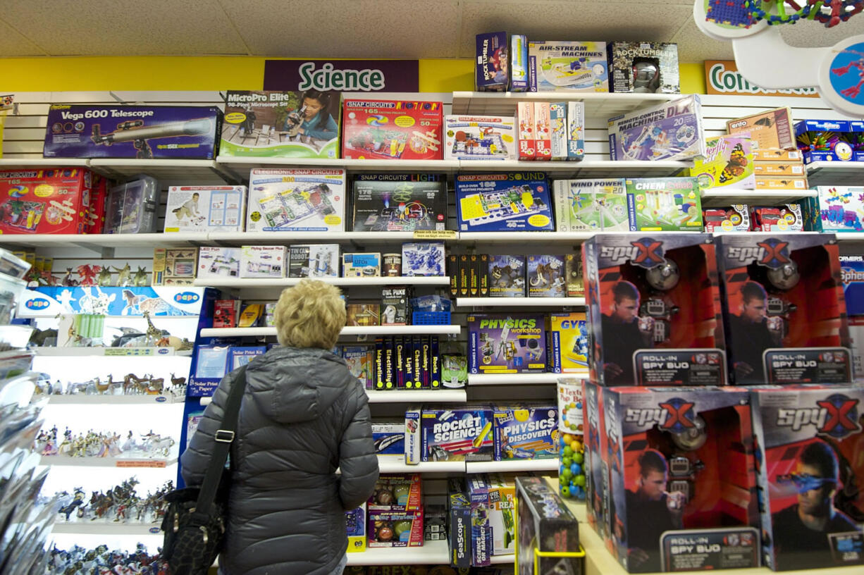 The Columbian files
A woman peruses science gifts at Kazoodles. The store's sales are up by 15 percent from a year ago, reflecting county-wide growth in retail sales that was reported by the Department of Revenue this week.