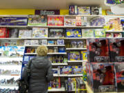 The Columbian files
A woman peruses science gifts at Kazoodles. The store's sales are up by 15 percent from a year ago, reflecting county-wide growth in retail sales that was reported by the Department of Revenue this week.