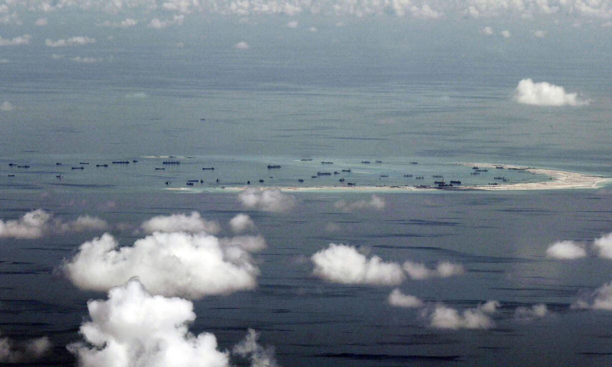 This photo taken May 11 from a military plane shows China's alleged building activity on Mischief Reef in the Spratly Islands.