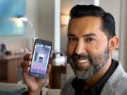 Alexis Espejo, marketing manager at the W Fort Lauderdale Hotel, shows the new keyless-entry app at the hotel.