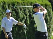 Nigel Lett, right, rebounded from back-to-back double bogeys to record pars on the final three holes and win the Royal Oaks Invitational Tournament.