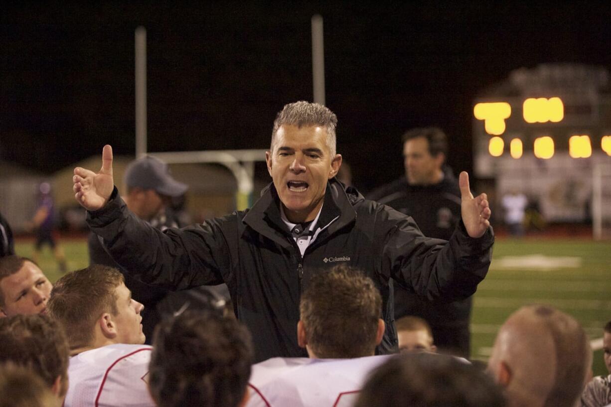 Camas coach Jon Eagle talks to the team after the Evergreen Game, October 11, 2013.Camas beats Evergreen 62-15.