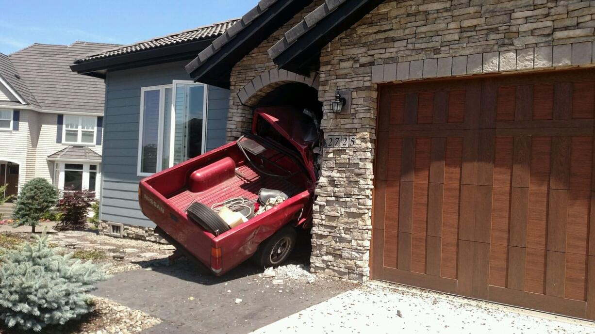 A red Nissan pickup crashed into the front door of a house in Camas's Prune Hill neighborhood.