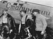 Navigator Alexander Belyakov, from left, co-pilot Georgy Baidukov and pilot Valery Chkalov stand by their plane on June 20, 1937, after completing a record-setting flight in Vancouver.