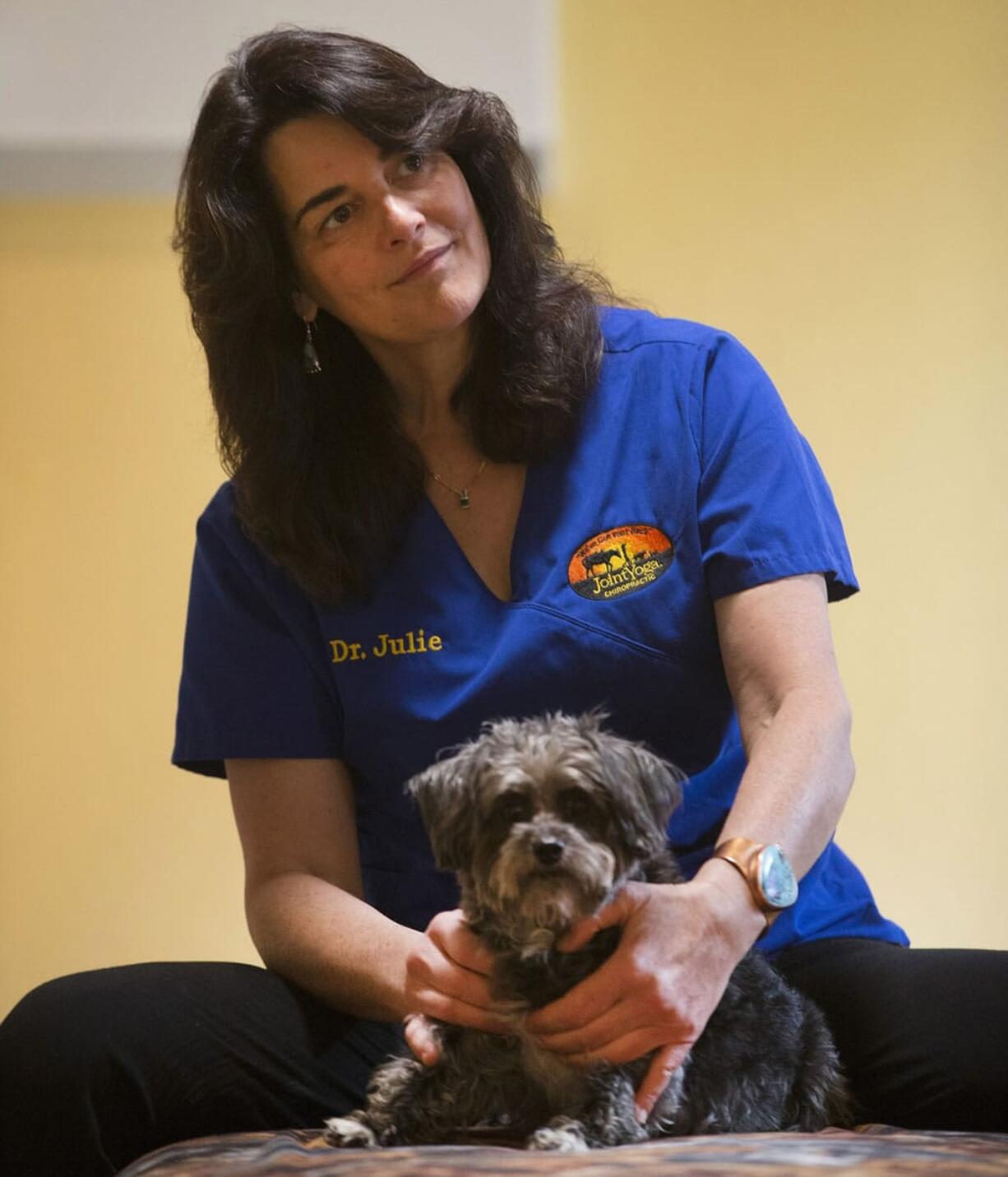 Chiropractor Julie Kaufman works with Turbo, who suffered from paralysis, on May 5 at Holistic Animal Specialists in Marshall, Wis.