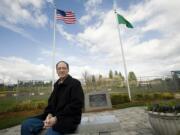 La Center Mayor Jim Irish sits at a memorial for Michael J. Nolan built at the city's baseball fields four years ago.