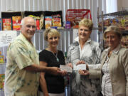 Central Park: The Lewis River Rotary and Battle Ground Rotary clubs raised $13,500 for the North County Food Bank, and presented the check on June 25.