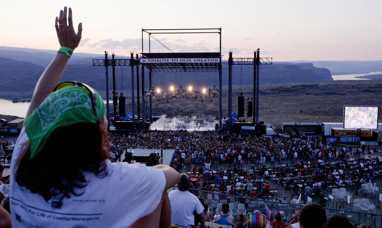 Photos by Daniel Houghton/The Seattle Times 
 Debbie Lehner of Ridgefield sings along near the end of Hawk Nelson?s performance at the Creation Northwest Christian music festival at The Gorge Amphitheater in Grant County. ORG XMIT: WASET103