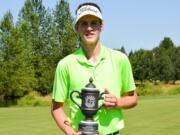 Spencer Tibbits of Fort Vancouver High School, poses with the champions trophy after winning the Oregon Junior Stroke Play Championship on Thursday, July 2, 2015, at OGA Golf Course in Woodburn, Ore.