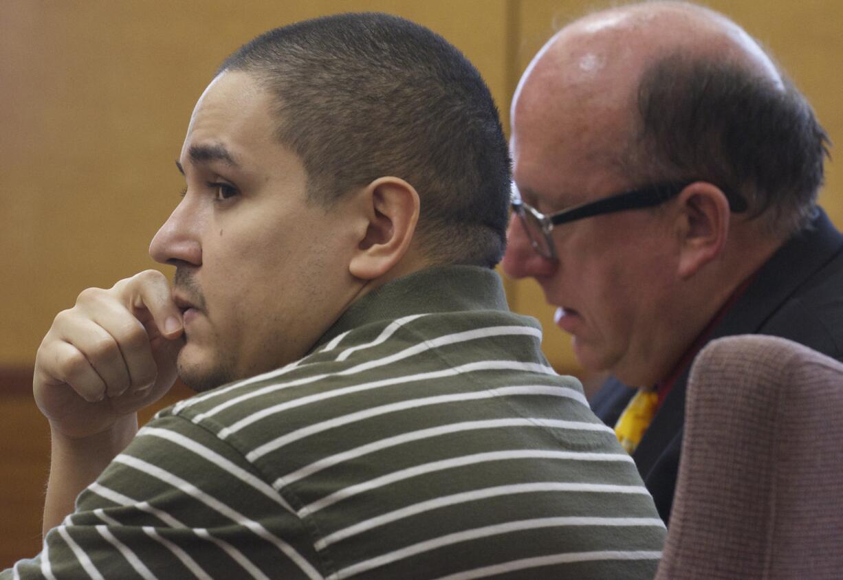 Marcus Morrison looks toward members of the jury as they are polled after finding him guilty July 7 of two counts of first-degree attempted murder with egregious lack of remorse.